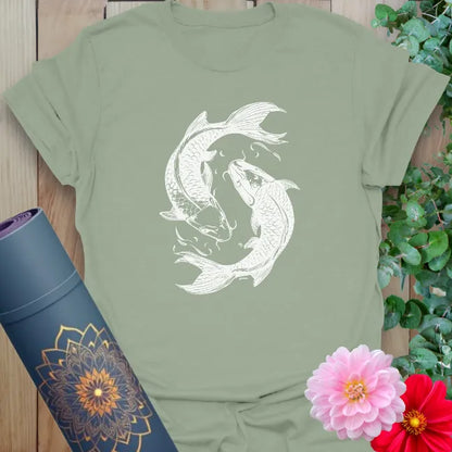 Calm sage green yoga t-shirt with flowing koi fish design representing soulful balance and spiritual harmony.