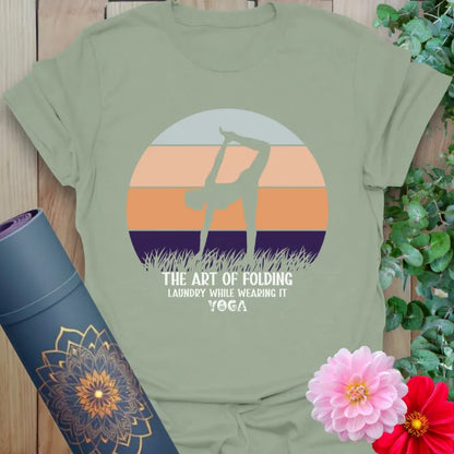 Calm sage green yoga t-shirt with lighthearted yoga folding quote and yogi silhouette perfect for soulful laughter and mindful flow.
