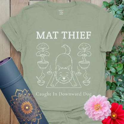 Sage Mat Thief T-Shirt featuring a minimalist dog in Downward Dog pose; calming color with fun yoga humor.