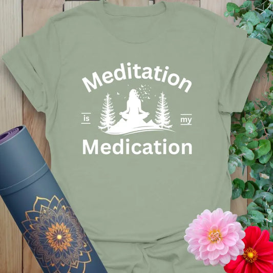 Calm sage green yoga t-shirt featuring peaceful yogi meditation and mindful forest scene for grounded, heart-centered living.