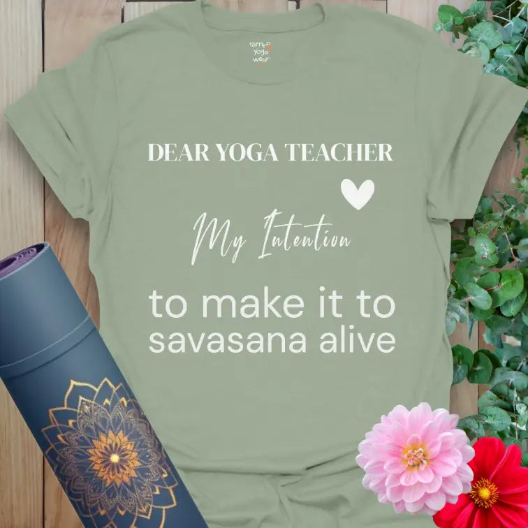 Sage My Intention T-Shirt with soft premium typography and a lighthearted savasana quote. Fresh yoga tee with heart detail.