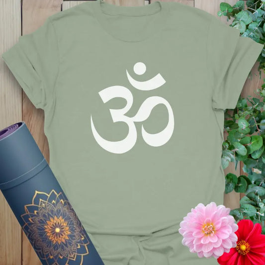 Calm sage green yoga t-shirt featuring sacred Om symbol inspiring grounded soulful living and heart-centered mindfulness.