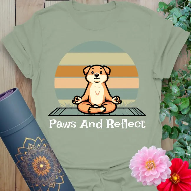 Calm sage green yoga t-shirt featuring peaceful dog meditation scene with sunset backdrop for grounded mindful moments.