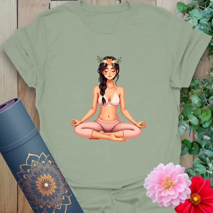 Calm sage green yoga t-shirt featuring gentle yogi in lotus pose with peaceful floral accents for grounded, mindful living.