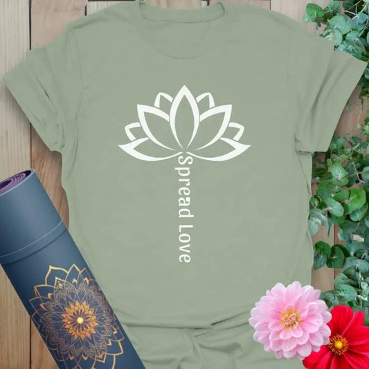 Sage green yoga t-shirt with white lotus and mindful “Spread Love” mantra for peaceful, heart-led movement.