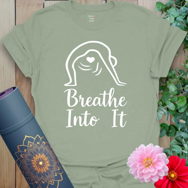 Sage green yoga t-shirt with graceful line art and breath-based mantra for intentional, calming energy.