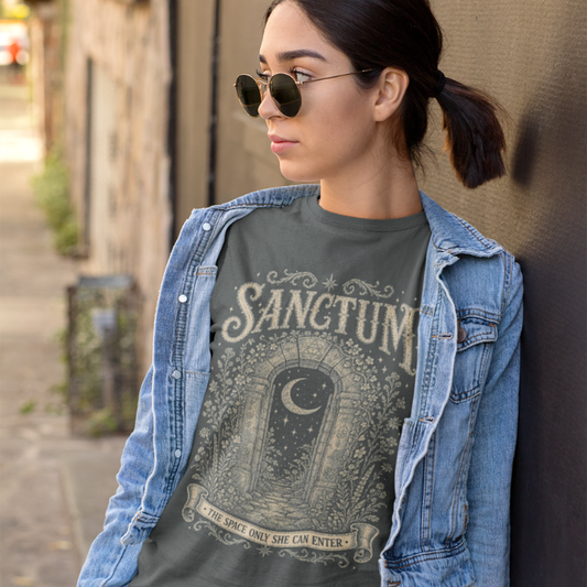 Woman wearing Sanctum dark heather grey meditation shirt leaning against a wall — Dark Sacred Stillness collection by Ramro Yoga Wear