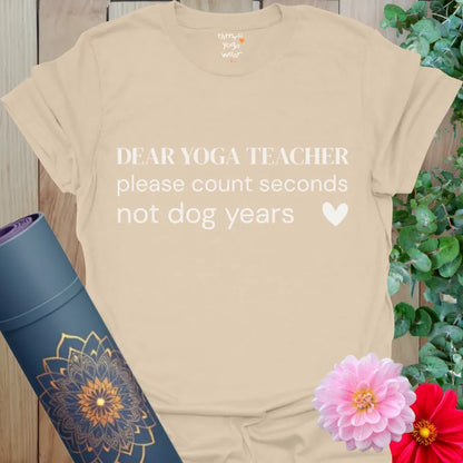 Sand Dog Years T-Shirt with minimalist yoga quote: “Dear Yoga Teacher, please count seconds not dog years.” Funny yoga shirt for calm practice.