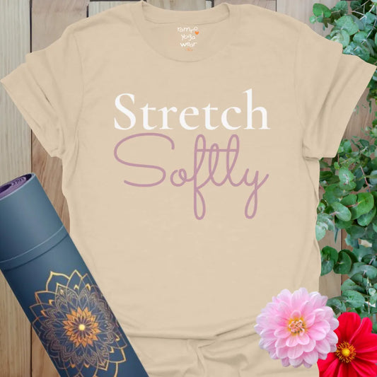 Neutral sand tee with peaceful “Stretch Softly” design in white and pink script. Yoga gift for calm practice.