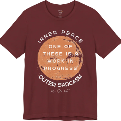 A grunge tee with a sun-washed circular design, text reading "Inner Peace," "One of these is a work in progress," and "Outer Sarcasm" — Funny Yoga Shirts collection by Ramro Yoga Wear in Heather Cardinal.