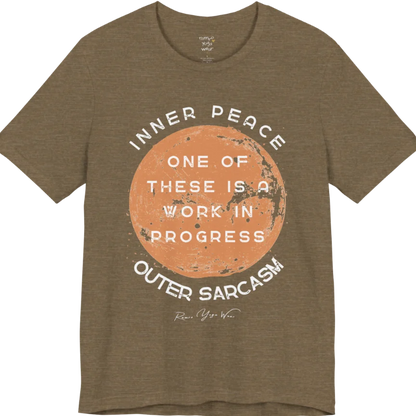 A grunge tee with a sun-washed circular design, text reading "Inner Peace," "One of these is a work in progress," and "Outer Sarcasm" — Funny Yoga Shirts collection by Ramro Yoga Wear in Heather Olive.
