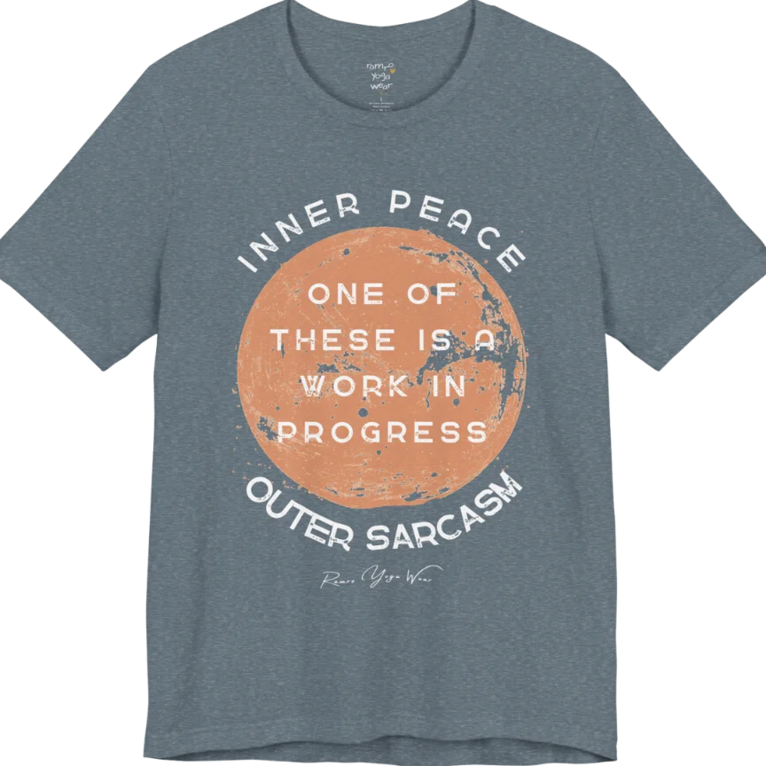 A grunge tee with a sun-washed circular design, text reading "Inner Peace," "One of these is a work in progress," and "Outer Sarcasm" — Funny Yoga Shirts collection by Ramro Yoga Wear in Heather Slate.
