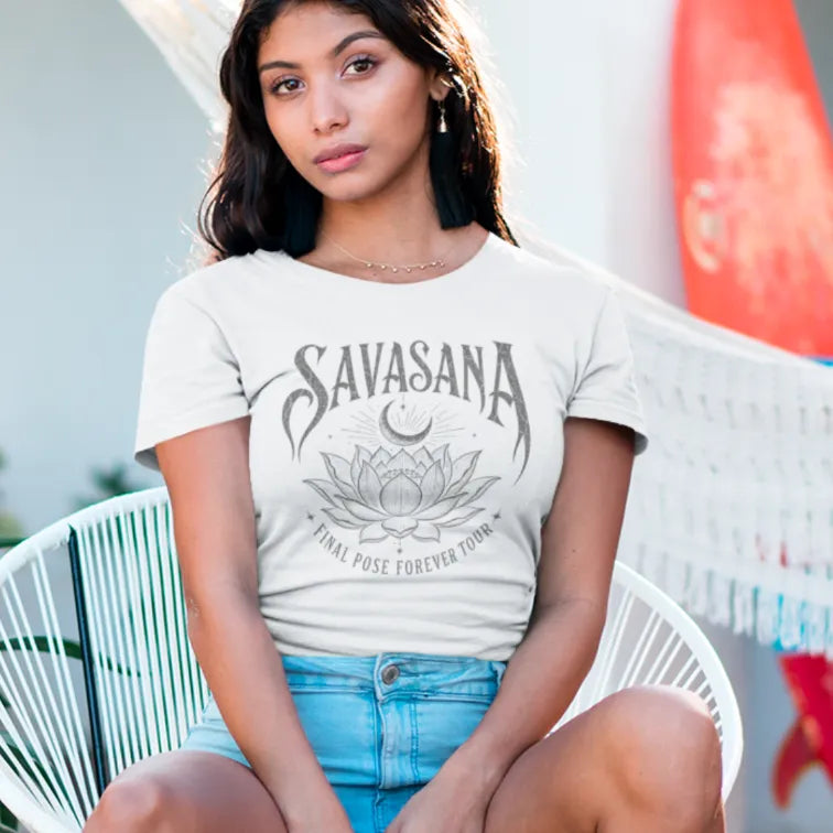 Savasana T-Shirt in White worn by woman outdoors featuring vintage lotus artwork and calm mindful lifestyle styling.