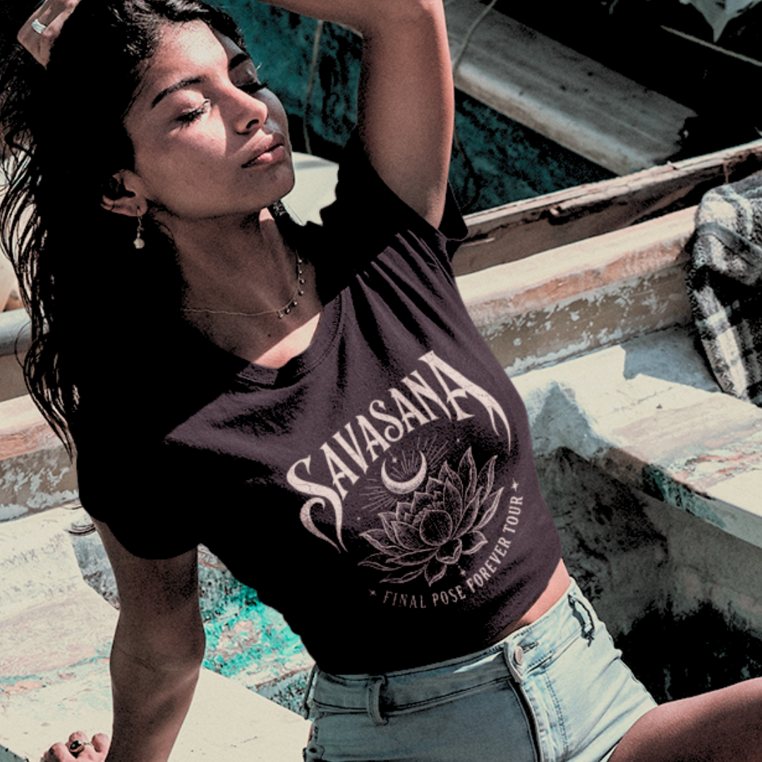Ramro Yoga Wear Savasana tee in Black — gothic lotus and crescent moon design, coastal boat lifestyle shot