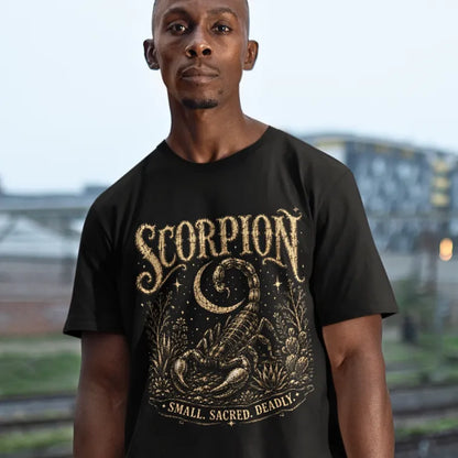 Person wearing Scorpion Black tee, standing outdoors near a railway with buildings in the background — Wild Animals collection by Ramro Yoga Wear