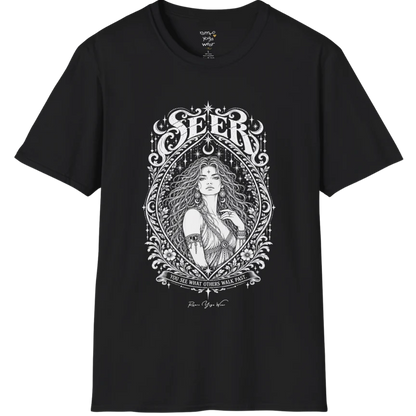 A short sleeved tee called the Seer T-Shirt, flat lay and a soft cotton shirt. Simply says, You see what others walk past. Design highlights an ornate engraved almond-shaped frame of florals and filigree around a close portrait of a long-haired figure with a star on the brow, crescent moon earrings and one hand at the collarbone, beneath a crescent moon and hanging stars, with Seer in decorative lettering across the top and the tagline on a banner below. Color is Black.