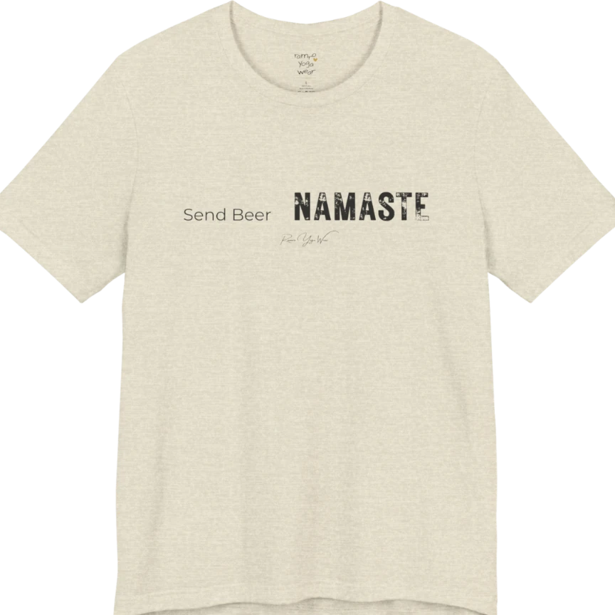 "Send Beer" in small script, followed by a  bold "NAMASTE" lettering. Send Beer T-Shirt flat lay is a Bella+Canvas 3001 and the color is Heather Prism Natural.