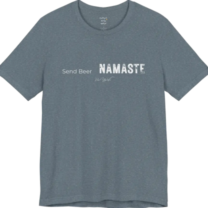 "Send Beer" in small script, followed by a  bold "NAMASTE" lettering. Send Beer T-Shirt flat lay is a Bella+Canvas 3001 and the color is Heather Slate.