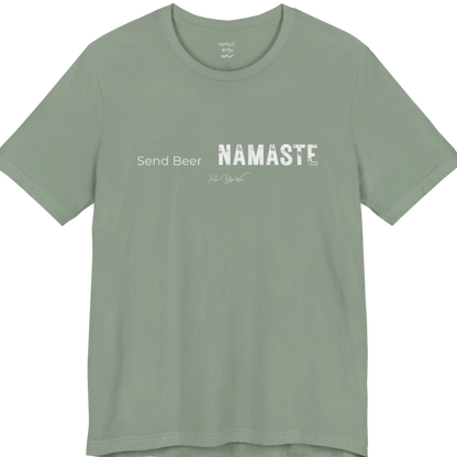 "Send Beer" in small script, followed by a  bold "NAMASTE" lettering. Send Beer T-Shirt flat lay is a Bella+Canvas 3001 and the color is Sage.