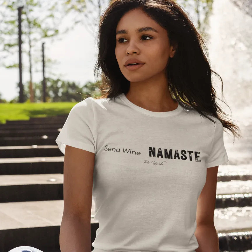Woman wearing Send Wine T-Shirt outdoors on stone steps, shirt in Heather Prism Natural