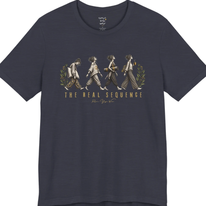Four illustrated figures walking in sequence — pillow, sunburst top, rolled yoga mat, and coffee cup — framed by botanical leaf sprigs. Sequence T-Shirt flat lay is a Bella+Canvas 3001 and the color is Heather Midnight Navy.