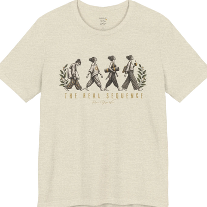 Four illustrated figures walking in sequence — pillow, sunburst top, rolled yoga mat, and coffee cup — framed by botanical leaf sprigs. Sequence T-Shirt flat lay is a Bella+Canvas 3001 and the color is Heather Prism Natural.