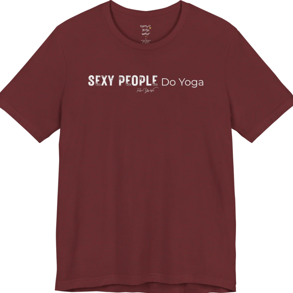 A short sleeved tee called the Sexy T-Shirt, flat lay and a soft cotton shirt. Simply says, Sexy People Do Yoga. Design highlights bold distressed block lettering for Sexy People beside lighter thin lettering for Do Yoga, with a small script signature underneath. Color is Heather Cardinal.