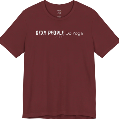A short sleeved tee called the Sexy T-Shirt, flat lay and a soft cotton shirt. Simply says, Sexy People Do Yoga. Design highlights bold distressed block lettering for Sexy People beside lighter thin lettering for Do Yoga, with a small script signature underneath. Color is Heather Cardinal.