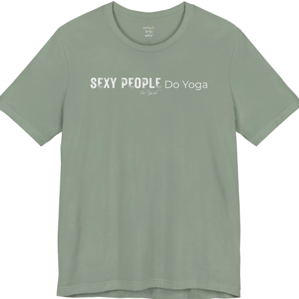 A short sleeved tee called the Sexy T-Shirt, flat lay and a soft cotton shirt. Simply says, Sexy People Do Yoga. Design highlights bold distressed block lettering for Sexy People beside lighter thin lettering for Do Yoga, with a small script signature underneath. Color is Sage.