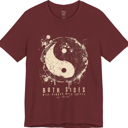 A short sleeved tee called the Sides T-Shirt, flat lay and a Bella+Canvas 3001 shirt. Simply says, Both Sides Will Always Need Coffee. Design highlights a cracked, splattered grunge yin yang with ink drips. Color is Heather Cardinal.