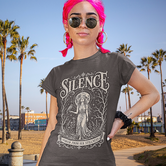 Woman wearing Silence dark chocolate sacred meditation shirt at the beach — Dark Sacred Stillness collection by Ramro Yoga Wear