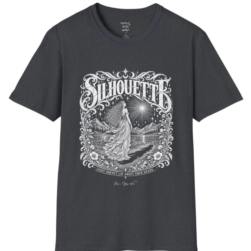 A short sleeved tee called the Silhouette T-Shirt, flat lay and a Gildan 64000 shirt on a white background. Simply says, Light Doesn't Lie About Your Shape. Design highlights a long-haired figure in a flowing gown gazing at a radiating star, framed by ornate florals, mountains and a lake, with the figure's cast shadow on the path. Color is Dark Heather Grey.