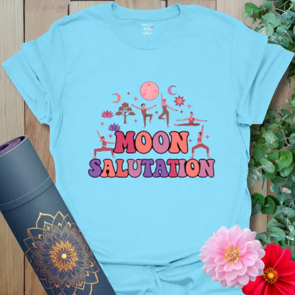 Sky Moon Salutation T-Shirt with celestial yoga illustration in soothing lavender and coral. Perfect for moonlight practice.