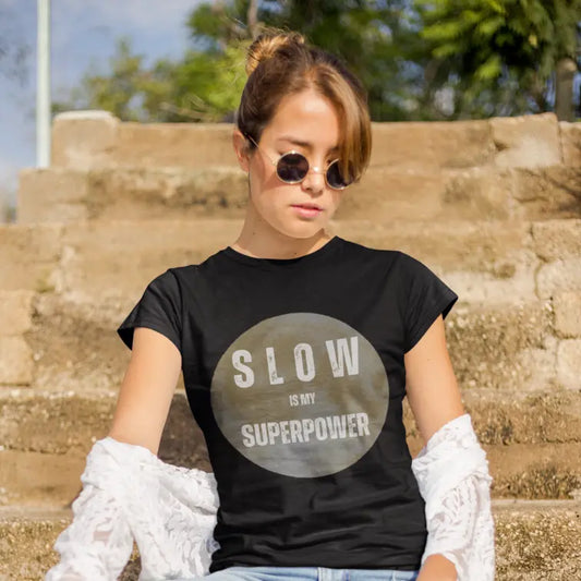 Black Slow T-Shirt styled in relaxed outdoor lifestyle setting with vintage moon design.