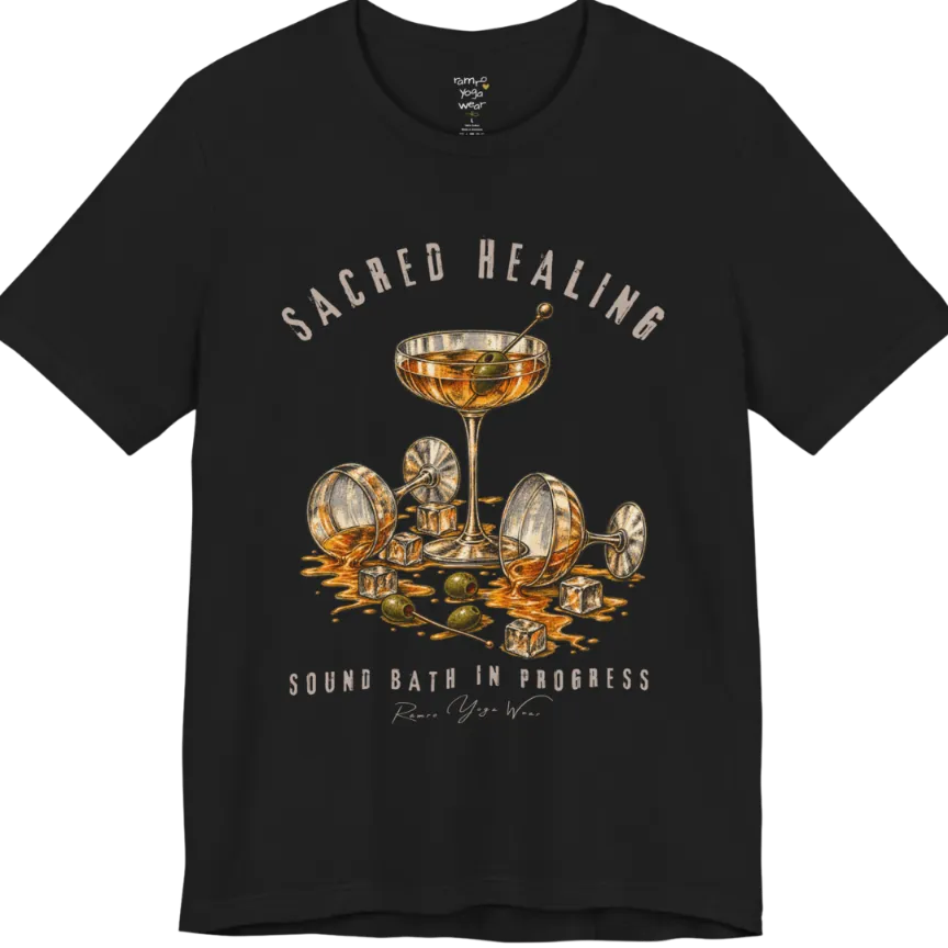 A grunge tee with an illustrated design of three cocktail glasses — one upright, two spilled with ice cubes and olives scattered — text reading "Sacred Healing" and "Sound Bath In Progress" — Funny Yoga Shirts collection by Ramro Yoga Wear in Black.