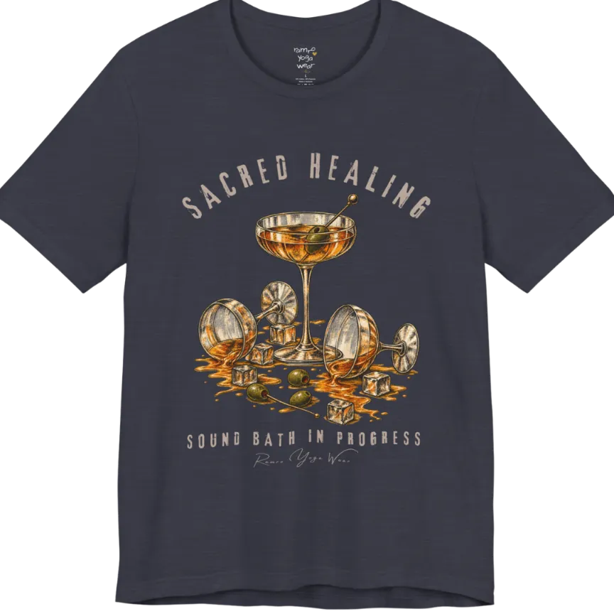 A grunge tee with an illustrated design of three cocktail glasses — one upright, two spilled with ice cubes and olives scattered — text reading "Sacred Healing" and "Sound Bath In Progress" — Funny Yoga Shirts collection by Ramro Yoga Wear in Heather Midnight Navy.