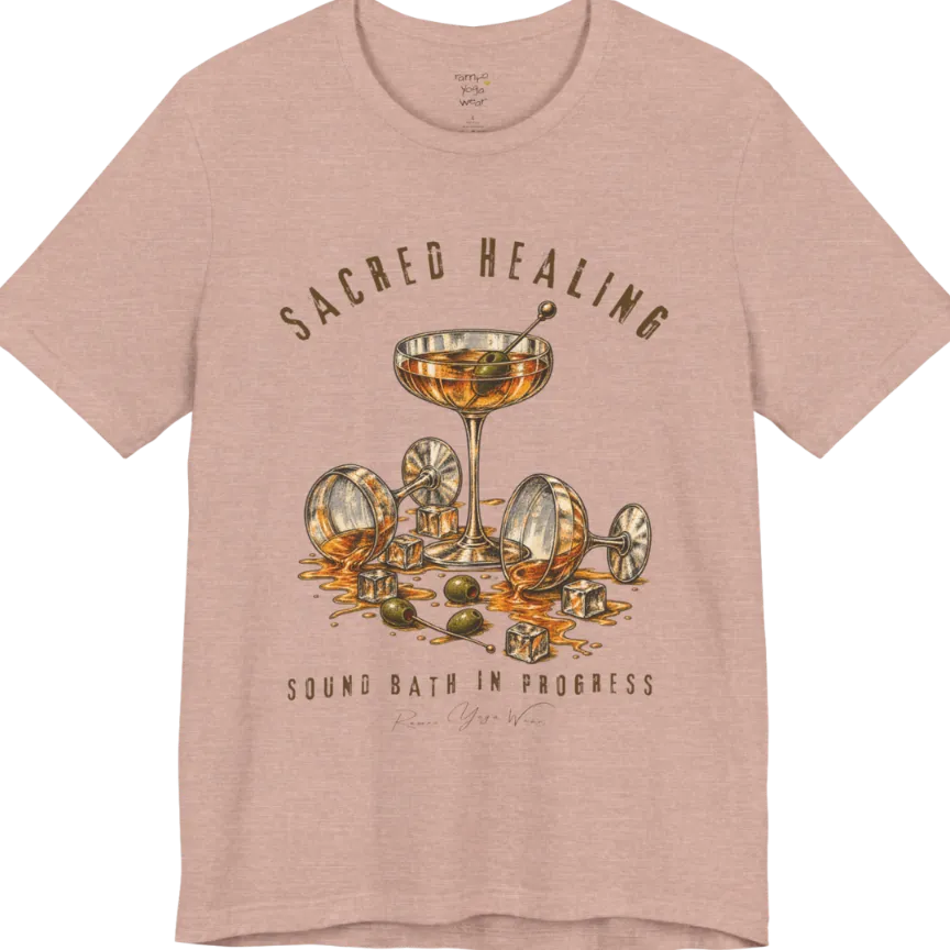 A grunge tee with an illustrated design of three cocktail glasses — one upright, two spilled with ice cubes and olives scattered — text reading "Sacred Healing" and "Sound Bath In Progress" — Funny Yoga Shirts collection by Ramro Yoga Wear in Heather Prism Peach.
