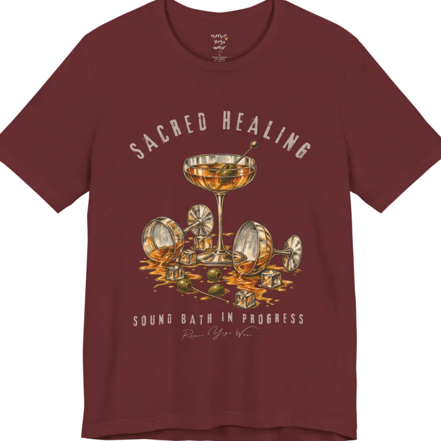 A grunge tee with an illustrated design of three cocktail glasses — one upright, two spilled with ice cubes and olives scattered — text reading "Sacred Healing" and "Sound Bath In Progress" — Funny Yoga Shirts collection by Ramro Yoga Wear in Heather Cardinal.