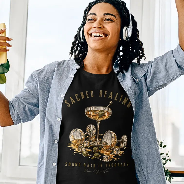 Person wearing the Sound Bath T-Shirt in Black, arms raised with headphones on — Funny Yoga Shirts collection by Ramro Yoga Wear.