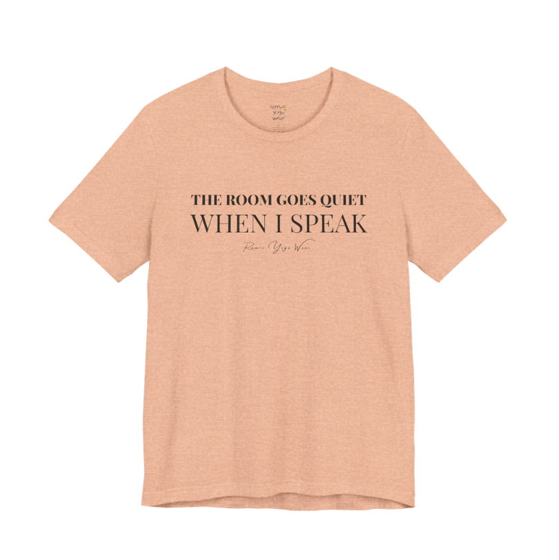 THE ROOM GOES QUIET WHEN I SPEAK yoga teacher gift tee flat lay in Heather Peach — Yoga Teacher Gifts collection by Ramro Yoga Wear