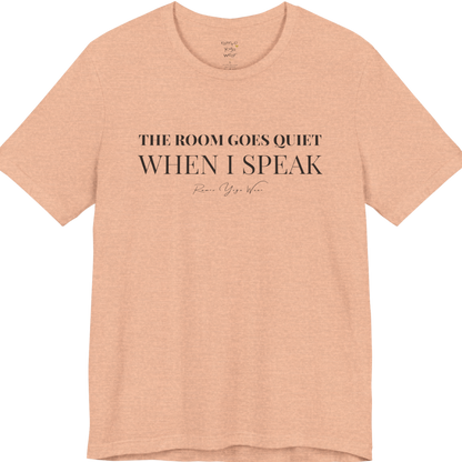 THE ROOM GOES QUIET WHEN I SPEAK yoga teacher gift tee flat lay in Heather Peach — Yoga Teacher Gifts collection by Ramro Yoga Wear
