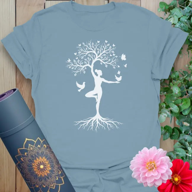 Stone blue yoga tee with peaceful tree pose artwork and natural tones