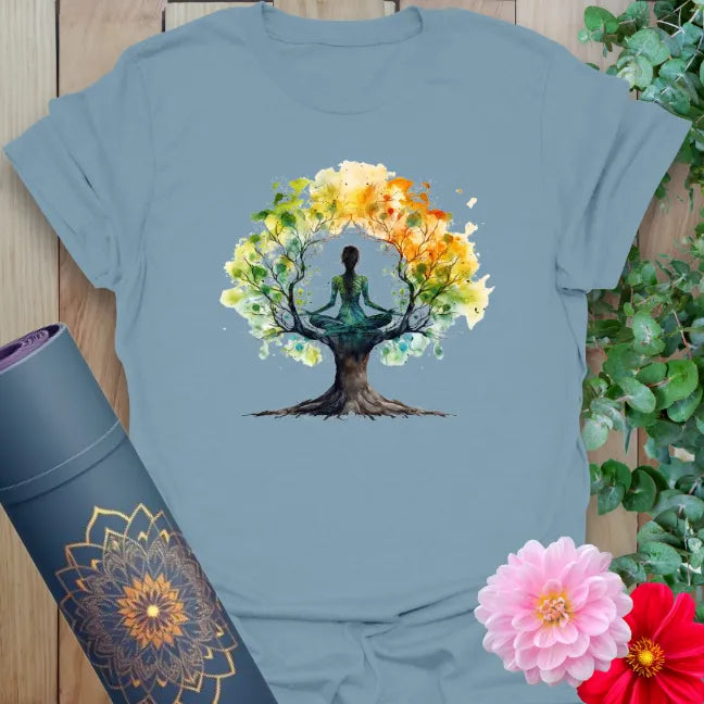 Stone blue yoga shirt featuring symbolic tree and yogi illustration in watercolor style