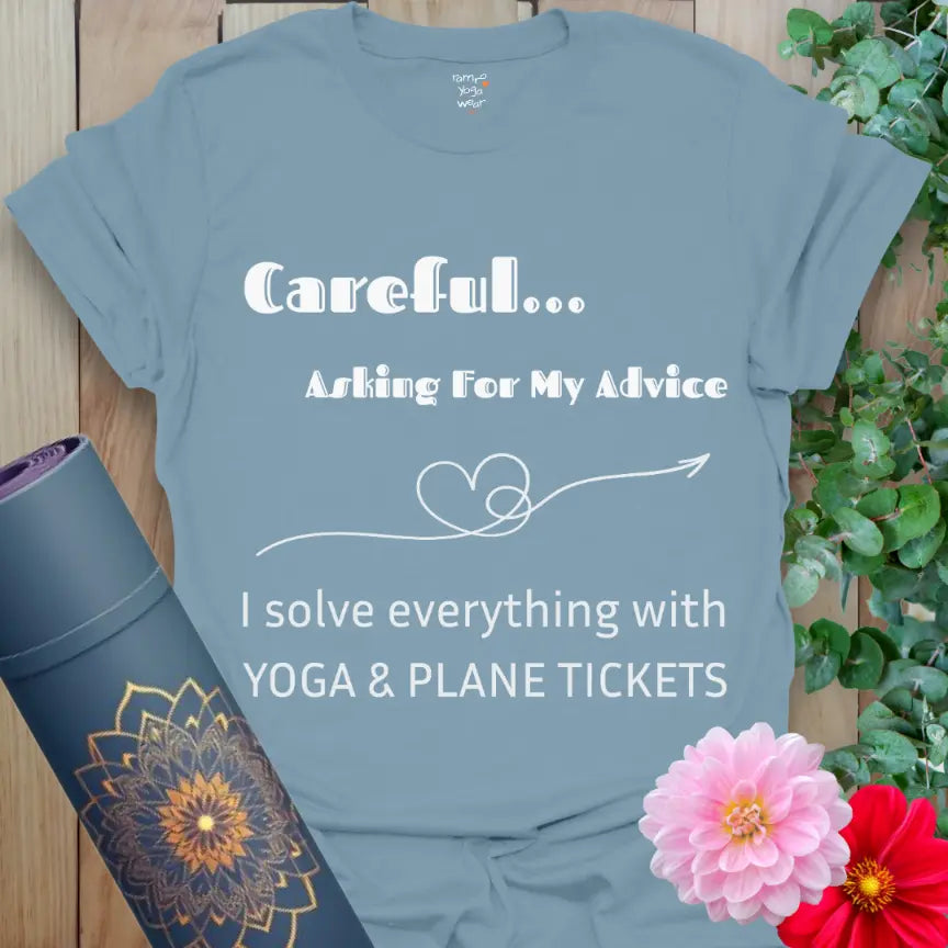 Stone Blue Careful T-Shirt with the quote “Careful… Asking For My Advice. I solve everything with yoga & plane tickets,” featuring a heart-arrow line art. Yoga and travel humor tee.