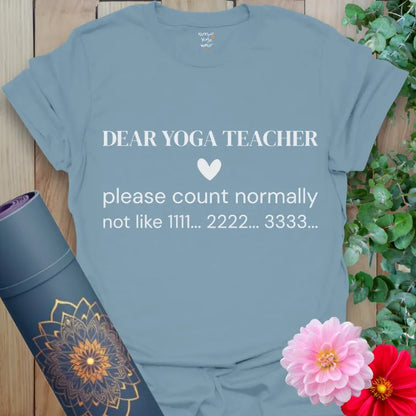 Stone Blue Count Normally T-Shirt with clean serif quote: “Dear Yoga Teacher, please count normally not like 1111… 2222… 3333…” Funny yoga gift tee.