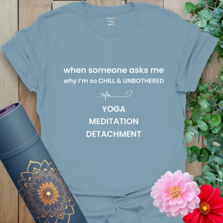 Stone blue yoga-inspired T-shirt with clean text design about calm, meditation, and detachment.