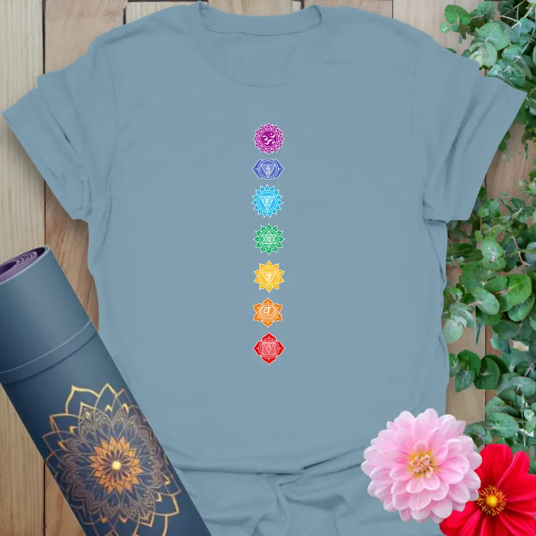 Muted stone blue yoga t-shirt with centered chakra energy design, perfect for yoga and meditation lifestyle.