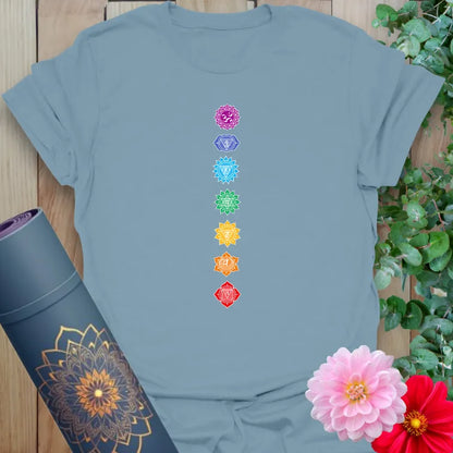 Muted stone blue yoga t-shirt with centered chakra energy design, perfect for yoga and meditation lifestyle.