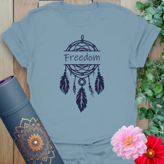 Muted stone blue yoga t-shirt featuring dreamcatcher and feather design symbolizing spiritual freedom, hope, and heartfelt living.