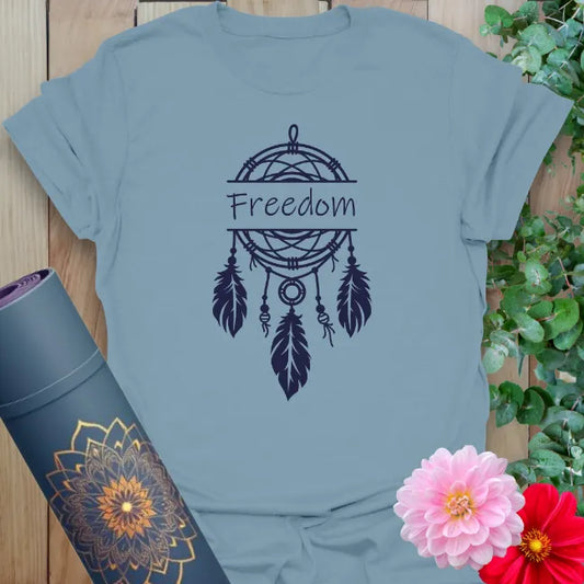 Muted stone blue yoga t-shirt featuring dreamcatcher and feather design symbolizing spiritual freedom, hope, and heartfelt living.